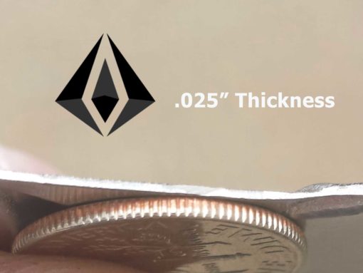 a photo showing the thickness of .025" diamond plate compared to the thickness of a US Quarter Dollar.