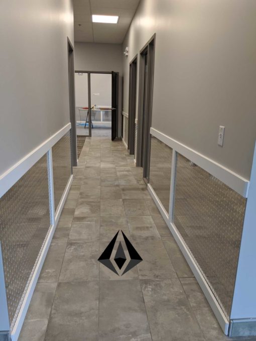 Diamond Plate installed in a hallway and finished with mdf trim